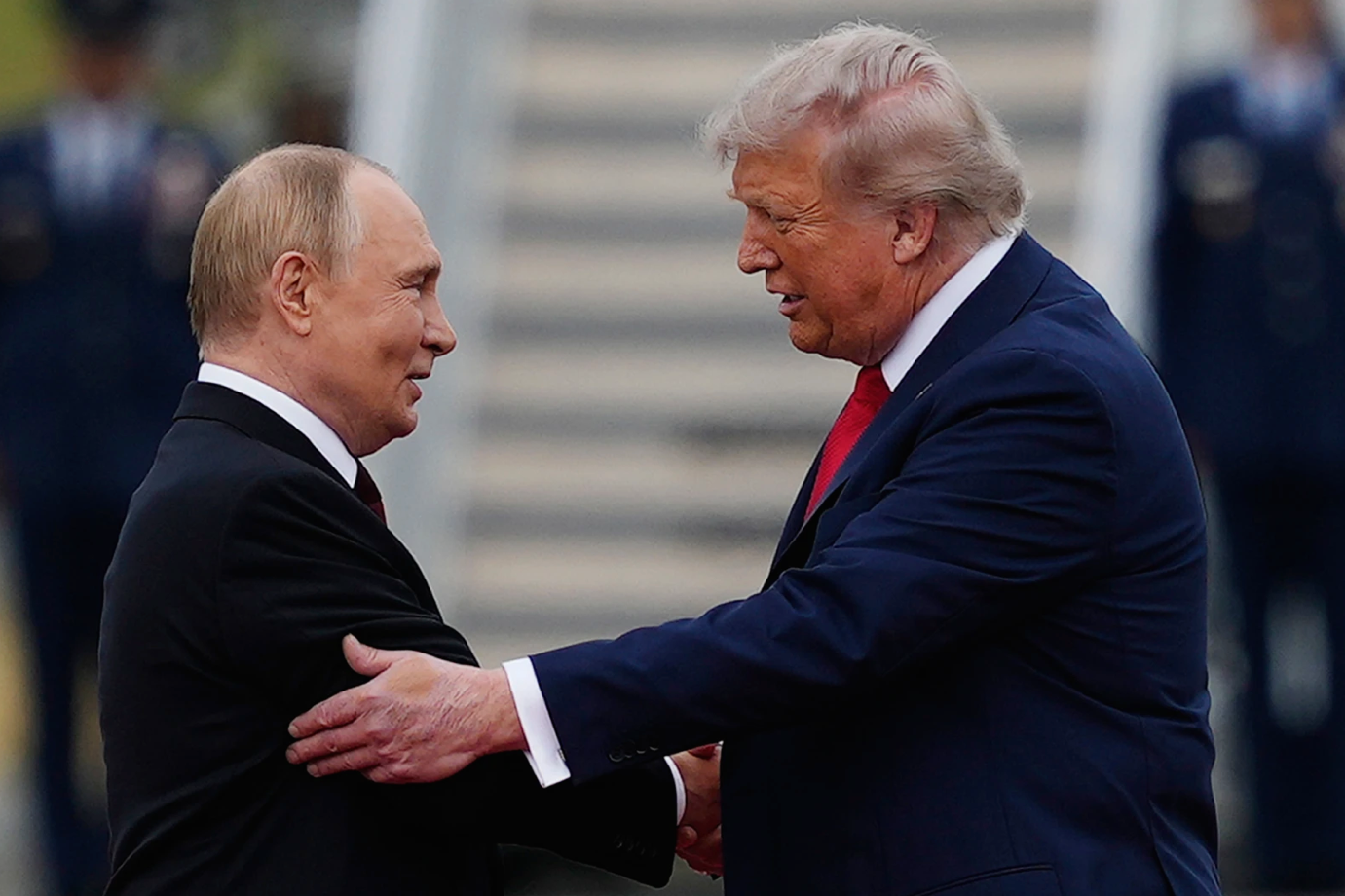U.S. President Donald Trump greets Russian President Vladimir Putin, Aug. 15, 2025, at Joint Base Elmendorf-Richardson, Alaska. Credit: AP Photo/Julia Demaree Nikhinson.